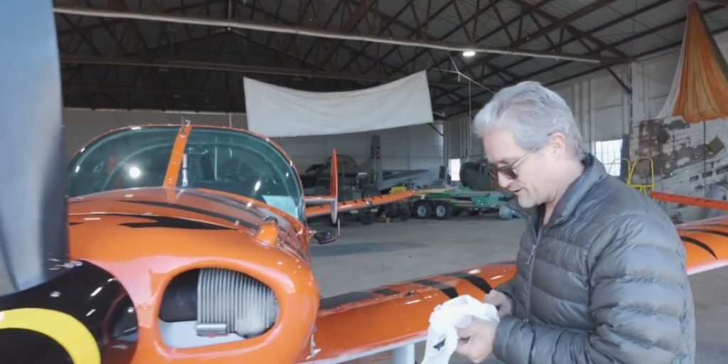 Kelly Keener inspects his Tiger Flight plane at the small airport in Rome, GA.
