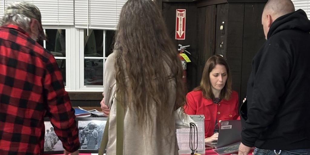 VA Providence's Micaela Costa helps a Veteran enroll with VA Healthcare.