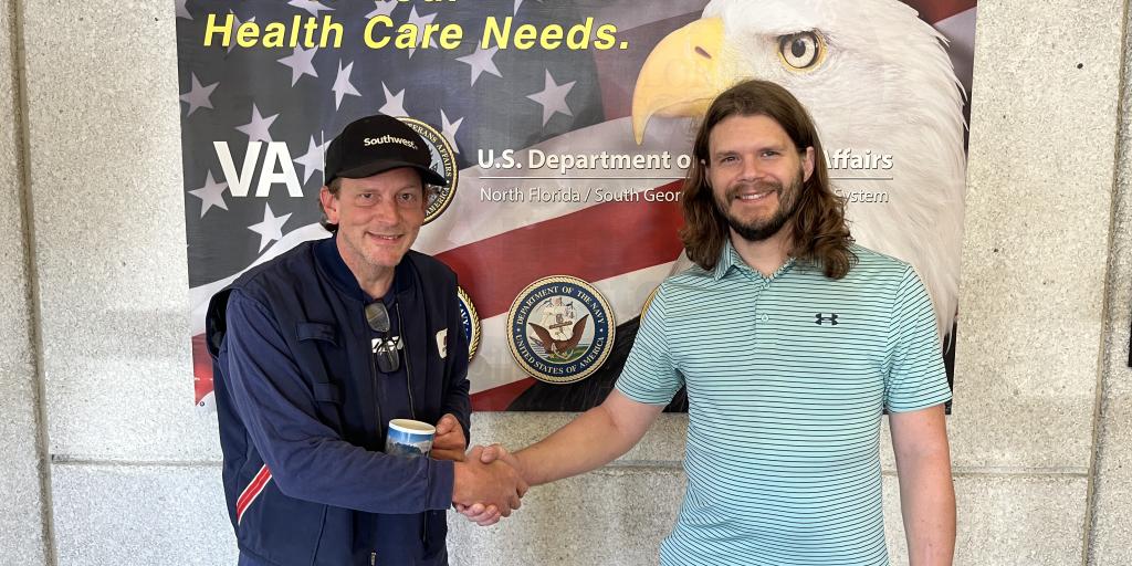 Veteran Edwaard with Employee Bond shaking hands where they first met