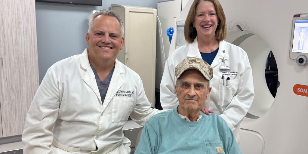 Marine Veteran Walter Lohden with his cancer care team, Dr. Christopher Bozarth and Dr. Teresa Craig, at Oklahoma City VA radiation oncology clinic