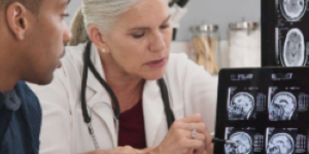 Provider and Veteran discussing at an appointment.