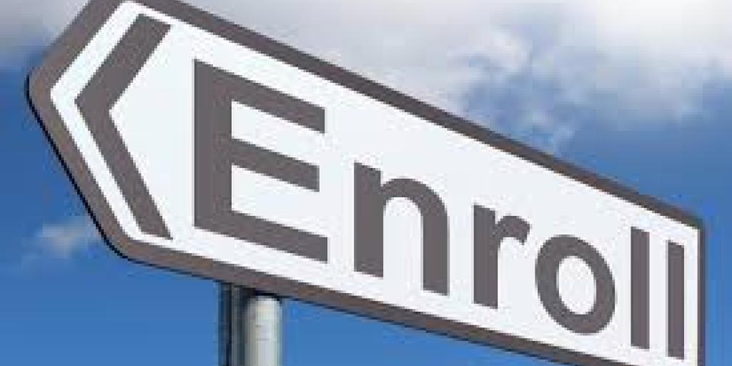 Sign with arrow pointing left and the word "Enroll" written in black on white background.