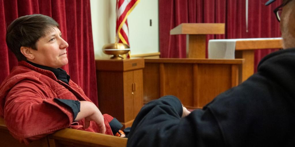 Chaplain Gretchen Hulse speaks with a veteran