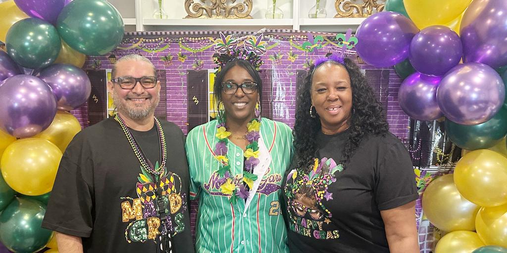 The Fisher House team, pictured left to right: Omar Luna, Erma Mickens, and Sandra Baldwin at the 17th-anniversary Fisher House Mardi Gras celebration. 