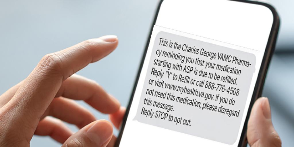 Hands holding smartphone displaying a text message.