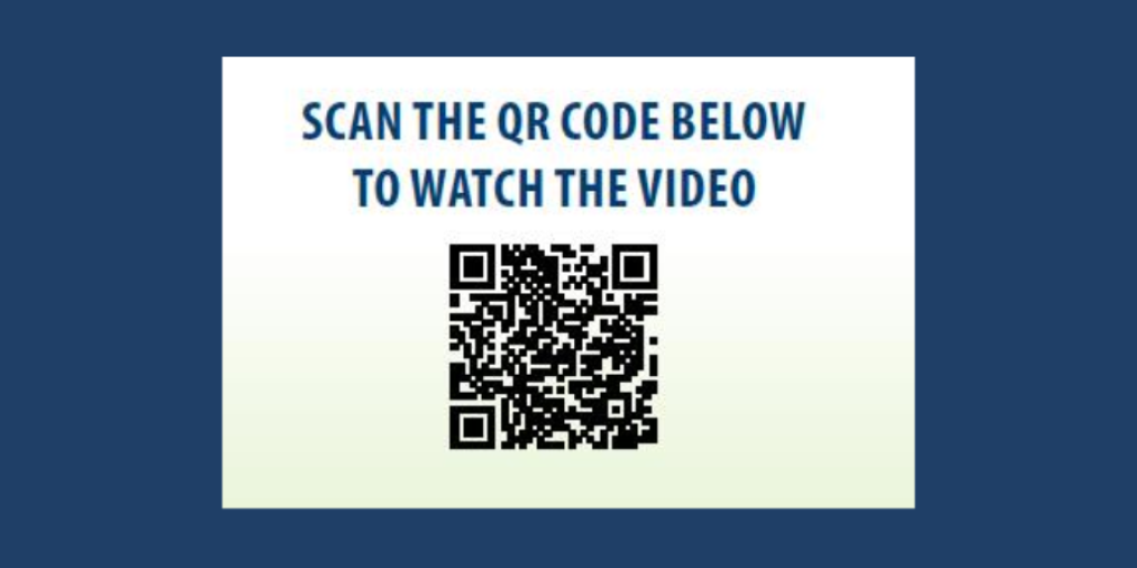 Sign with QR code and text: "SCAN THE QR CODE BELOW TO WATCH THE VIDEO".