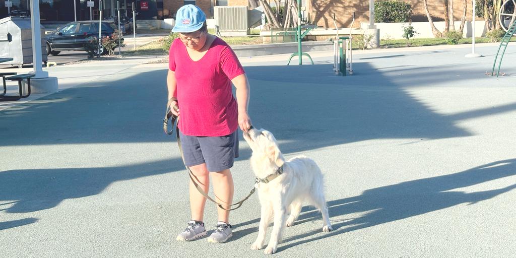 Marlyn Lee, a Critical Care Clinical Nurse Educator who created the Greater Los Angeles Veterans Service and Therapy Dog Program, works with her dog Violet, a future therapy dog, during a weekly training class.