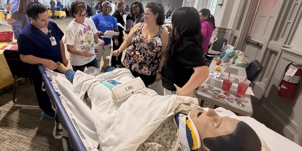 A nurse trains other clinical staff on CHG bathing during a recent competency forum at Dole VA.