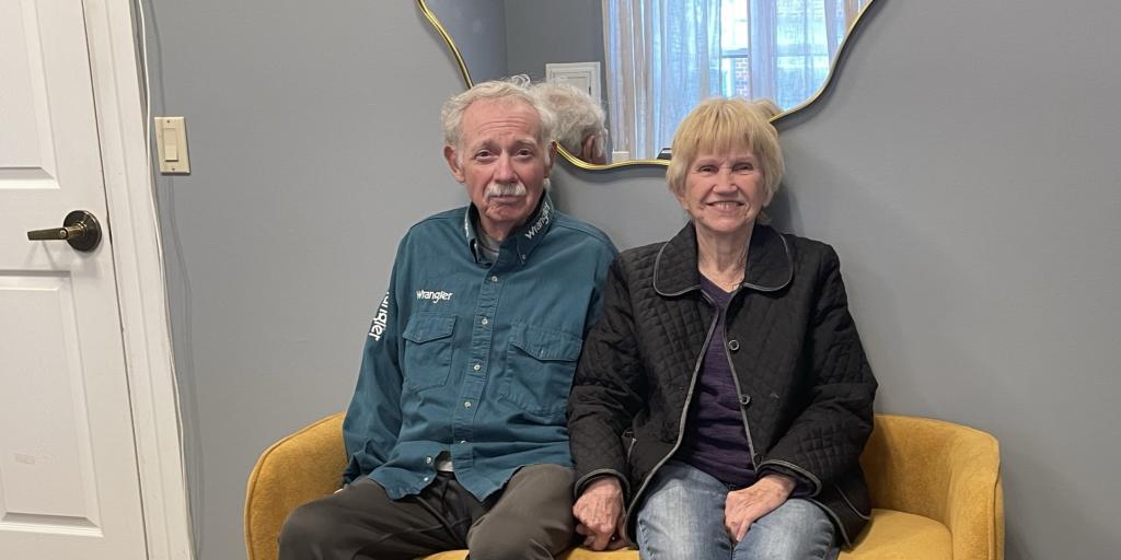 Veteran Charles Sasser and his wife, Donna Sasser, sit together at a senior living community supported through Community Residential Care.