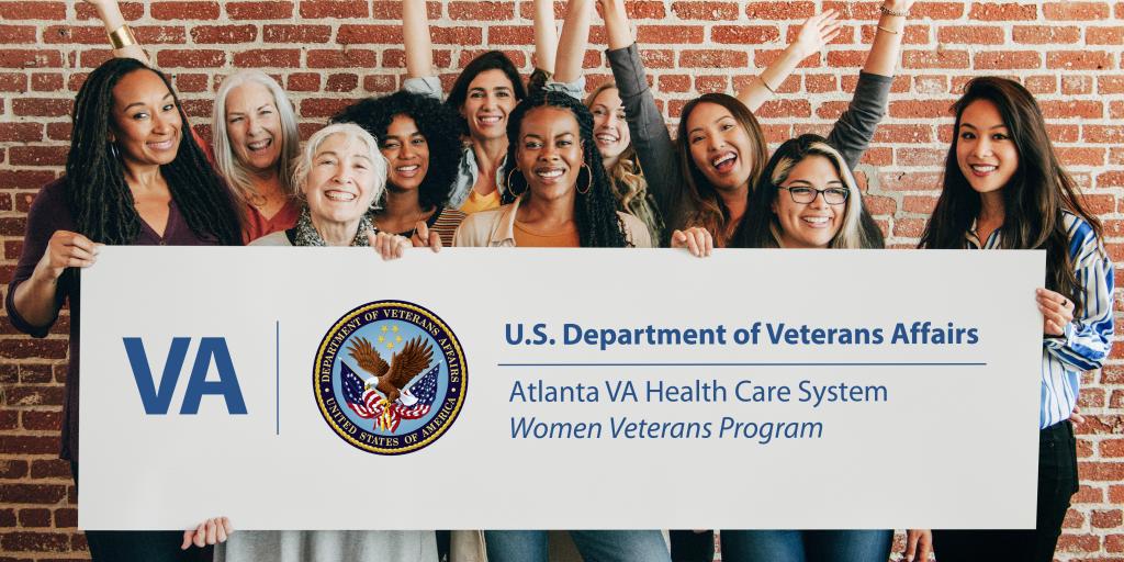 Group of women holding a sign for the VA Women Veterans Program.
