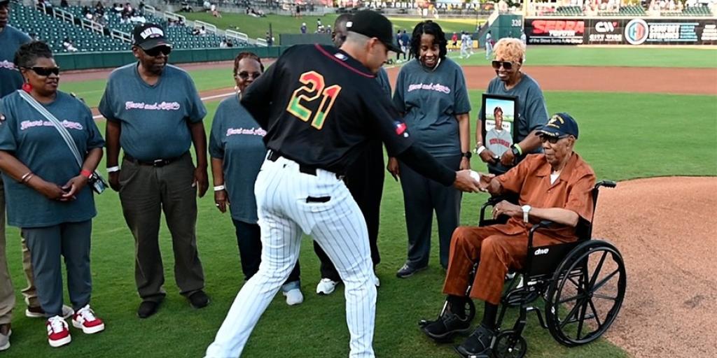 Reverend Bill Greason on field for the honorary first pitch.