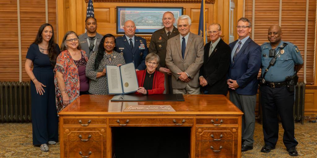 Dole VA HUDVASH coordinator attends bill signing with Kansas Gov. Laura Kelly.