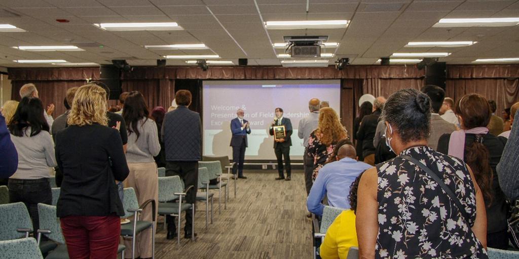 During the award ceremony, Dr. Steven Simon, Chief of Staff at VAGLAHS, presented Dr. Michael Ong, Associate Chief of Staff for Research, with the Inaugural National VA Office of Research and Development Field Research Leadership Excellence Award, drawing a standing ovation from the audience. 