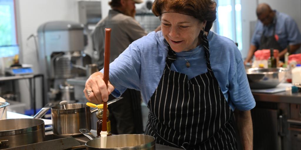 women veteran making stiring in a kitchen