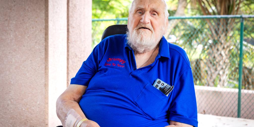 Army Veteran Ron “Grumpy” Singer sits outdoors at the Thomas H. Corey VA Medical Center’s Community Living Center.