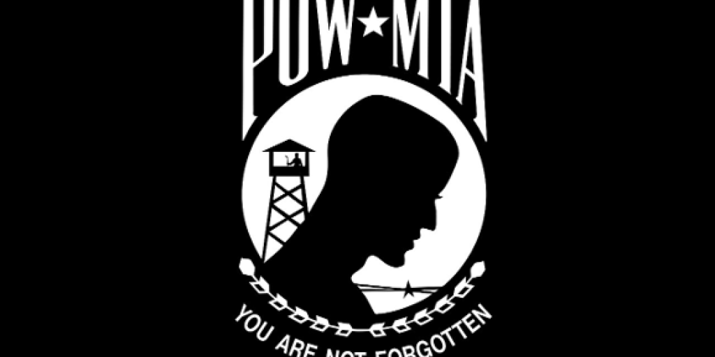POW MIA logo with silhouette of person and tower.