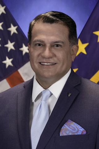 Executive Director Carlos R. Escobar