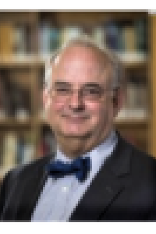 man in front of bookcase