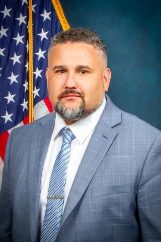 Shane Soto photographed in front of the US flag