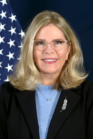 portrait image of Jennifer Harkins with a blue background