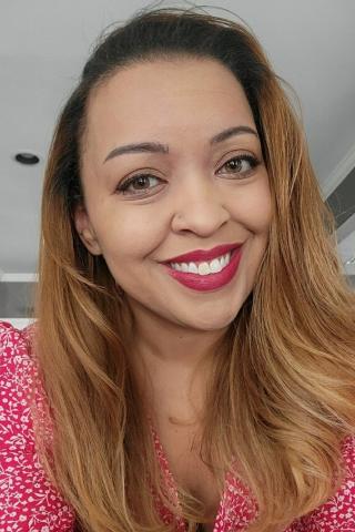 A close up of a person with a smile on their face