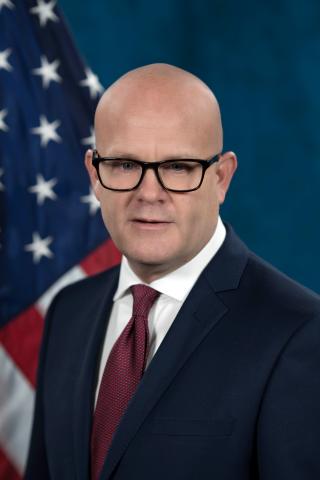 Garett Schreier,  Associate Director VA