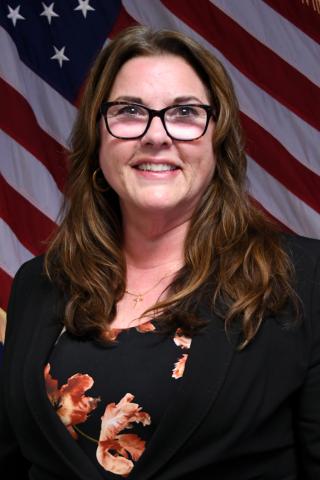 female smiling and wearing glasses
