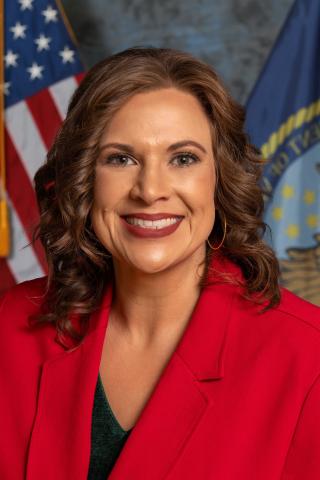 new nurse executive in front of American flag