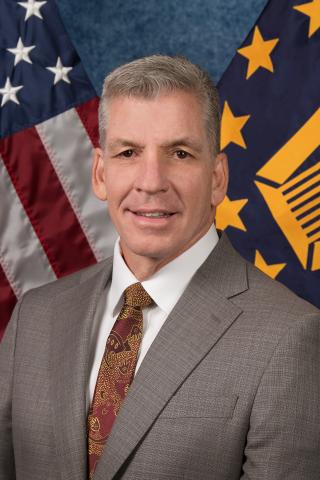 Head and shoulders portrait of Kevin Bass.