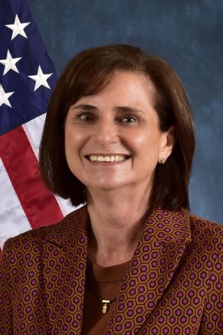 Ilona Schmalfuss in front of American Flag