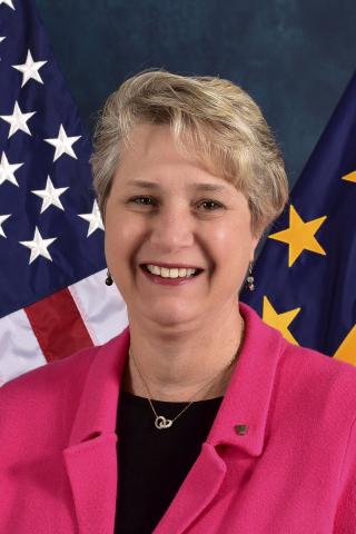 Wende Dottor in front of American flag