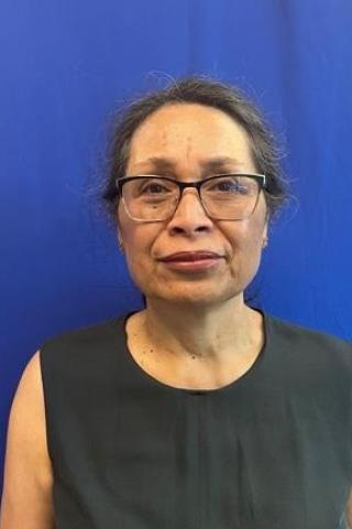 woman in front of blue