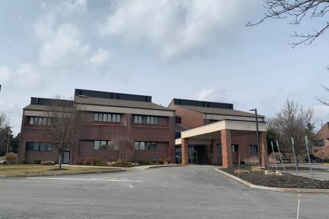 modern brick building with carport