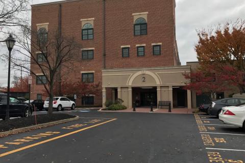 Building entrance from rear parking lot