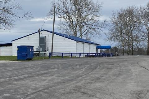 Photo of white building with blue roof