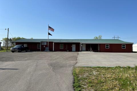 Red brick building with flags 