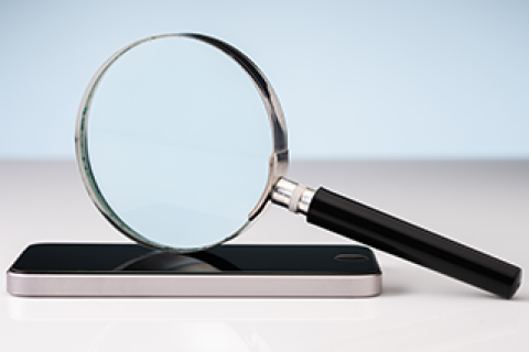 Magnifying glass on top of mobile phone