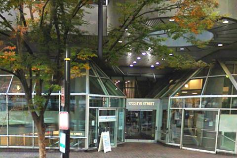 The entrance to the National Capital Region Benefits Office on 1722 I Street is embedded in a large glass faced structure resembling a greenhouse.