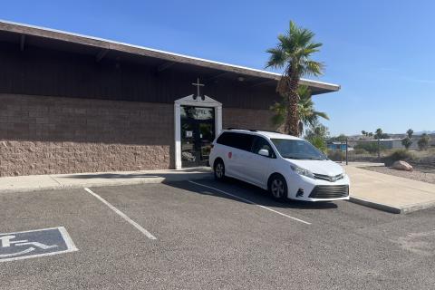 Brown Brick Building with a white framed "Chapel" door