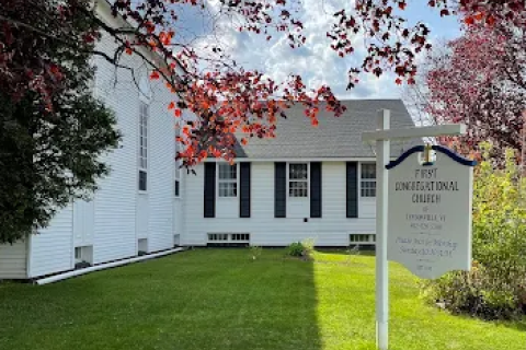 A white building with black shutters