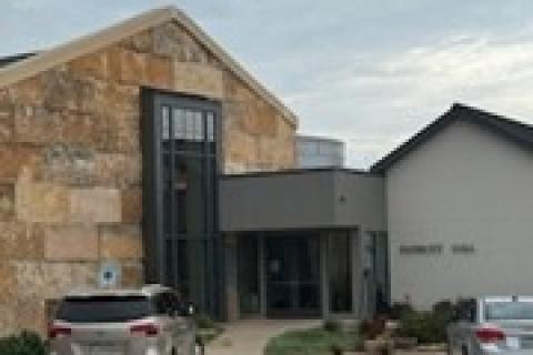 Entrance to Patriots Hall in Dripping Springs is through the double doors to left side of the gray building.
