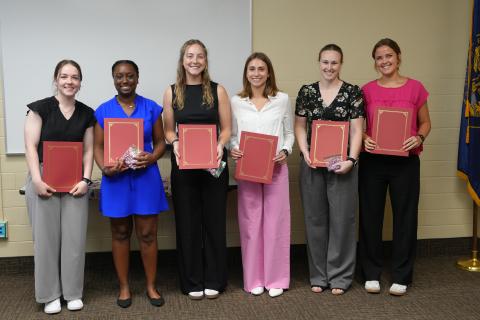 Six nursing students with their certificates after graduating from the VA STEP program. 