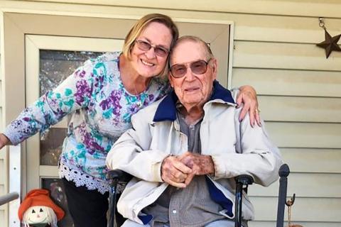 Veteran  Henry Ira White and his daughter at home