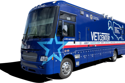 A blue 2024 Winnebago modified to hold two offices, bathroom, small refrigerator, generator, ADA Compliant wheelchair lift, with communication options 