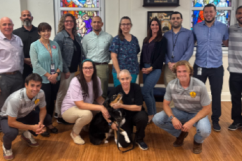 Rhode Island FC players Amos Shapiro Thompson (Left), Clay Holtstad (Middle), and Rio Hope-Gund pose for photos VA Providence Veterans and Staff.