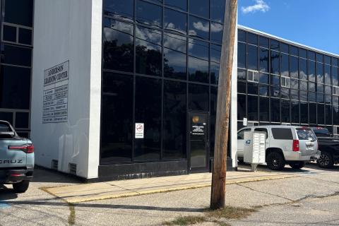 A white building with black windows.