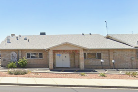 Tan Brick Building on the South Side of Airway