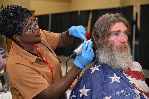 Veteran getting haircut at annual Stand Down. 