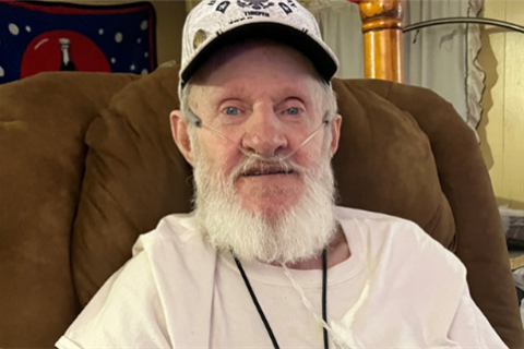 Veteran Sammy Thigpen sitting in a brown recliner