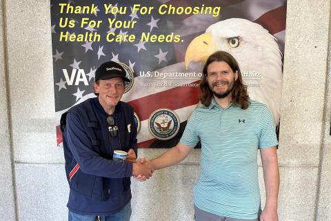 Veteran Edwaard with Employee Bond shaking hands where they first met